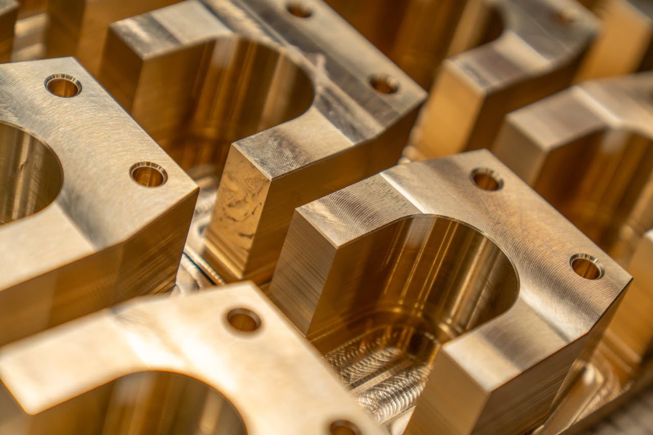 services-01 Detailed close-up of machined metal components in an industrial setting.