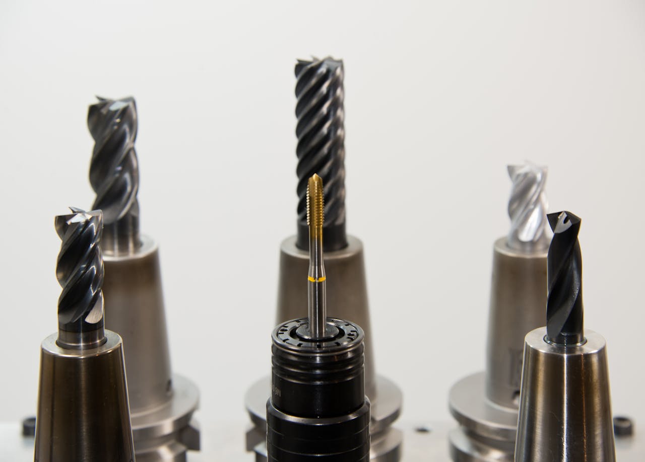 services-bg A detailed view of different drill bits used in industrial machining applications.